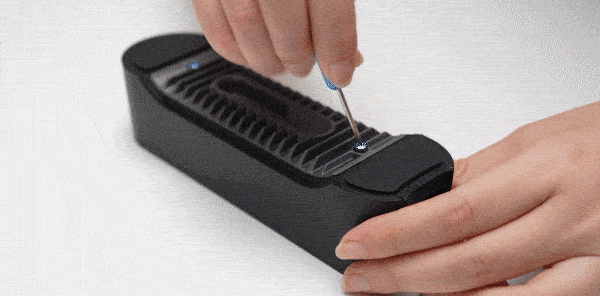 Using the screwdriver loosen the screws and remove the bottom panel.