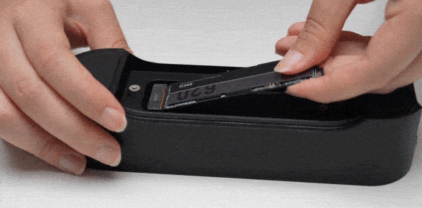 Insert the SSD into the slot and tighten the screw.