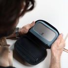Man holding a black carrying case for  PocketCloud portable NAS 